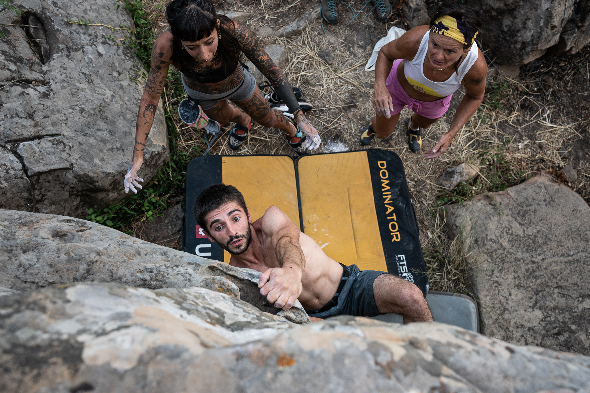 A group of rock climbers bouldering in Sicily