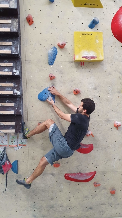 A person bouldering at karma in Fontainebleau
