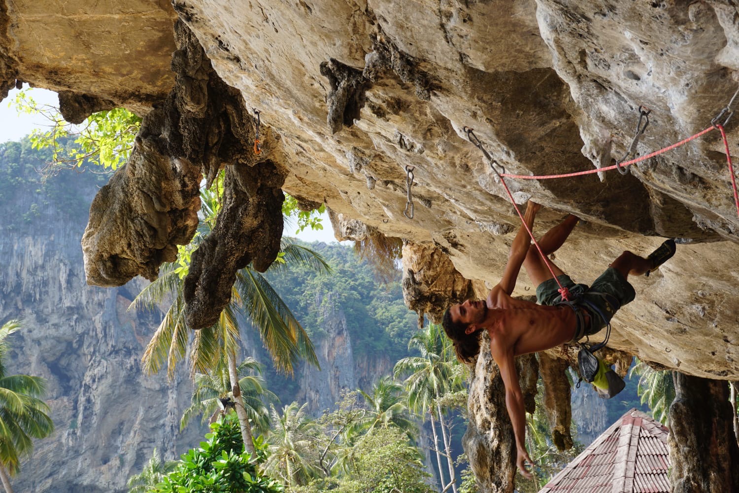 Juan rock climbing on a roof in Jamaica