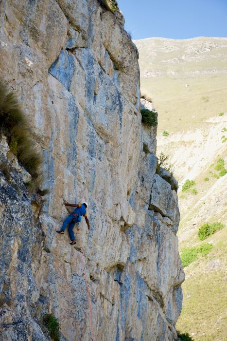 A climber making a first ascent in Dilijan, Armenia
