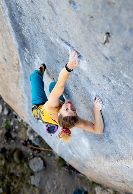 A rock climber sport climbing in Ceuse