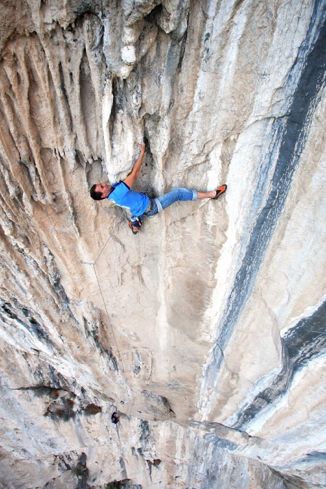 Canadian climber and bolter Ulric sport climbing on tufas
