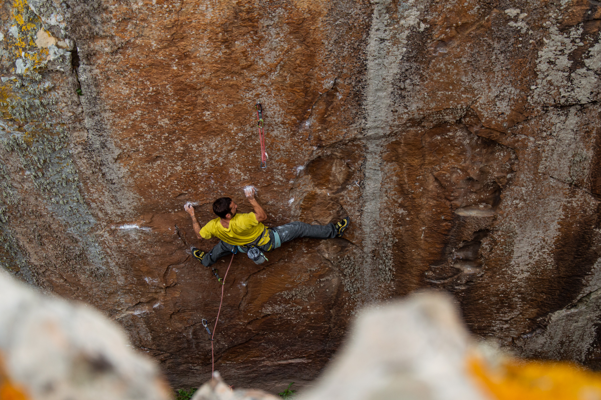 A rock climber wearing specialist climbing trousers