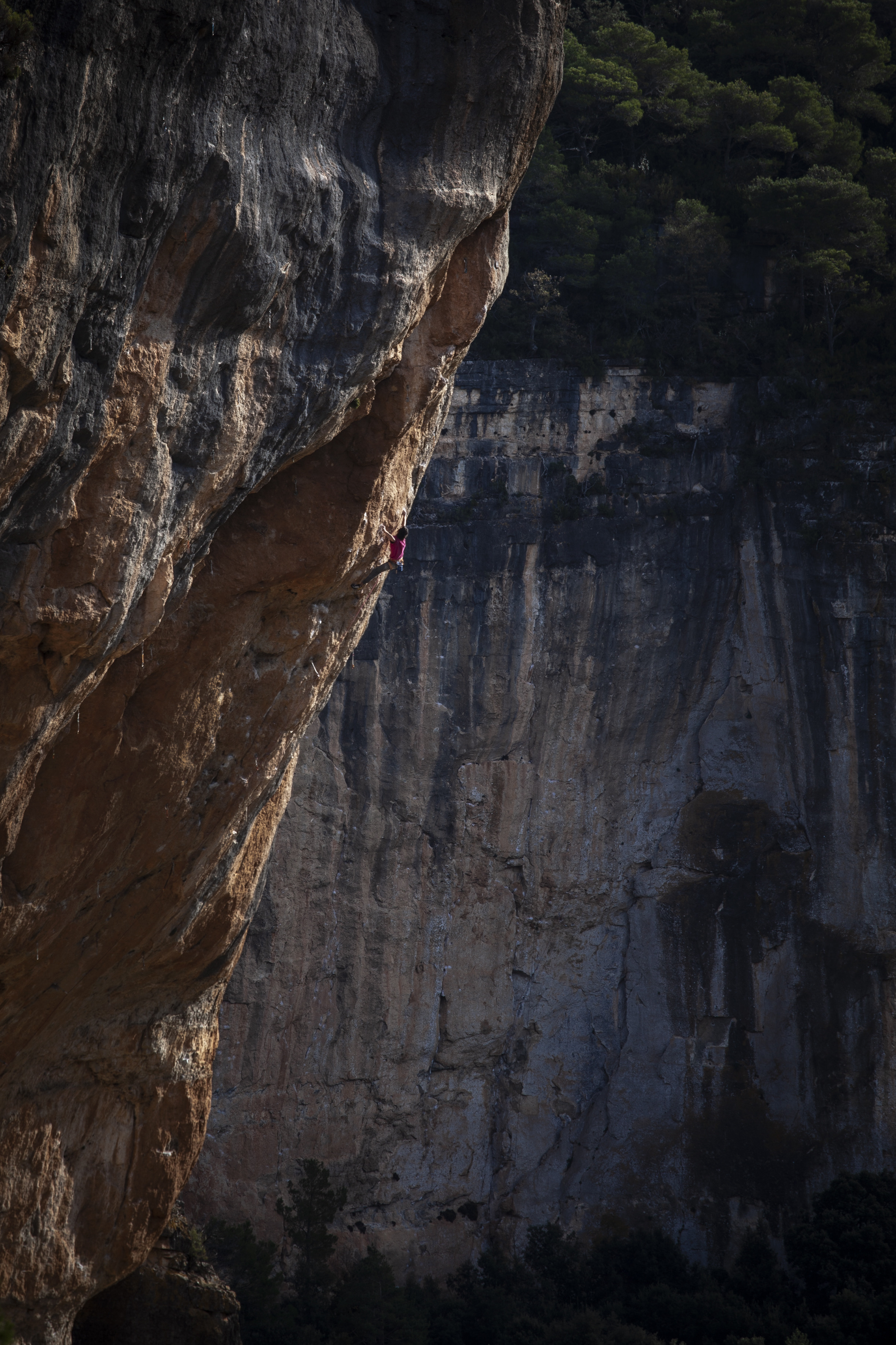 Longshot of a person sport climbing in Siurana, Catalonia