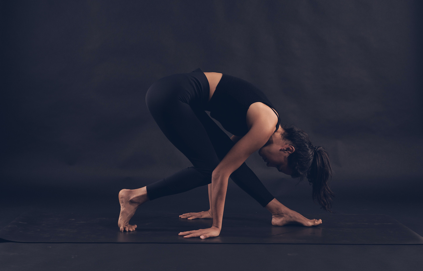 A person doing and extended triangle pose during a yoga for climbers session