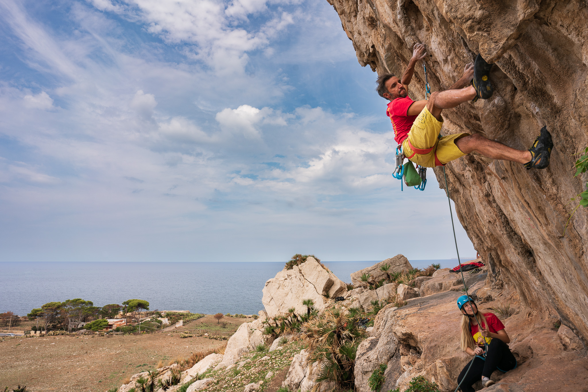 Cata climbing in Antro dei Ciclopi, a crag in Sicily bolted as part of the 2021 Share for Bolts initiative