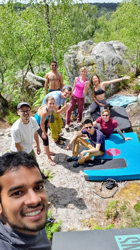 INSEAD students bouldering in the Fontainebleau forest