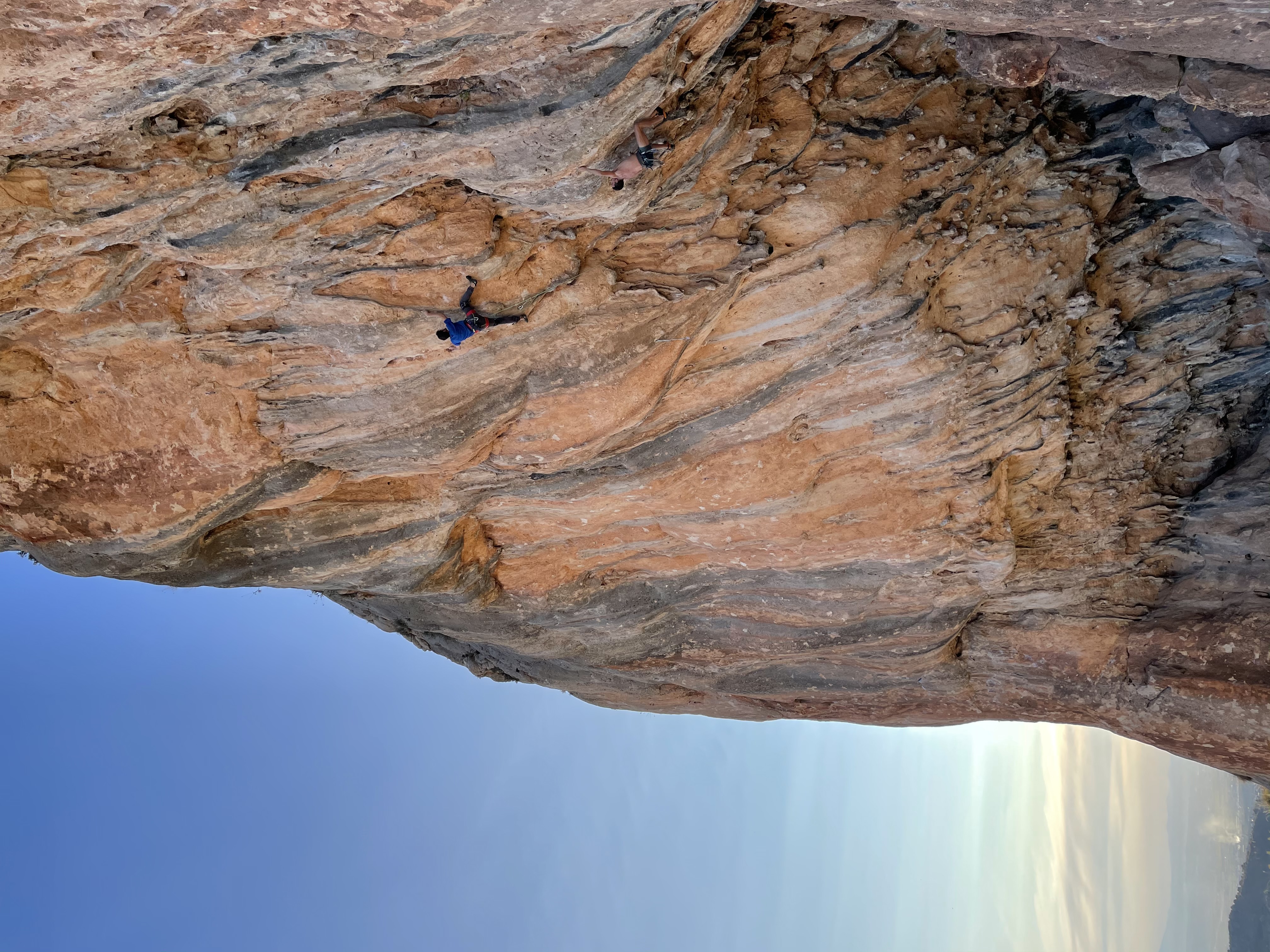 A person sport climbing at the Cogollos sector in Granada