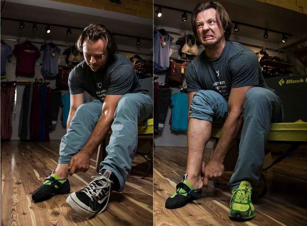 A person trying on rock climbing shoes